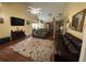 Comfortable living room features vaulted ceilings, ceiling fan, and a plush rug at 345 Annslee Circle Cir, Loganville, GA 30052