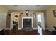 This open living room features a cozy fireplace and stylish hardwood floors at 345 Annslee Circle Cir, Loganville, GA 30052