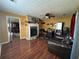 Living room with cozy fireplace, wet bar, and hardwood floors at 345 Annslee Circle Cir, Loganville, GA 30052