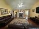 Spacious living room with a stone fireplace and warm hardwood floors at 345 Annslee Circle Cir, Loganville, GA 30052
