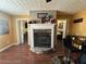 Cozy living room area features a stone fireplace and hardwood floors at 345 Annslee Circle Cir, Loganville, GA 30052