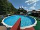 Outdoor pool with deck, ladder, and chairs for relaxing at 345 Annslee Circle Cir, Loganville, GA 30052