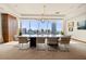 Bright conference room featuring a large table, modern lighting, and expansive windows with city views at 3630 Peachtree Ne Rd # 2706, Atlanta, GA 30326