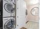 Laundry room with modern stacked washer and dryer units for convenient laundry care at 3630 Peachtree Ne Rd # 2706, Atlanta, GA 30326