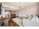 Open-concept living room with kitchen features hardwood floors, bright lighting, and comfortable seating at 3630 Peachtree Ne Rd # 2706, Atlanta, GA 30326