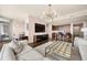 Open-concept living room with kitchen features hardwood floors, bright lighting, and comfortable seating at 3630 Peachtree Ne Rd # 2706, Atlanta, GA 30326