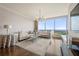 Bright living room features floor-to-ceiling windows with city views, modern chandelier, and hardwood flooring at 3630 Peachtree Ne Rd # 2706, Atlanta, GA 30326
