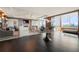 Elegant lounge area with wood accents, fireplace, television, and expansive windows with city views at 3630 Peachtree Ne Rd # 2706, Atlanta, GA 30326