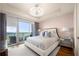 Bedroom suite featuring balcony access, luxury bedding, and floor-to-ceiling windows with city views at 3630 Peachtree Ne Rd # 2706, Atlanta, GA 30326