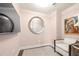 Sitting area with TV, a large round mirror and a comfortable chair for relaxation at 3630 Peachtree Ne Rd # 2706, Atlanta, GA 30326
