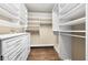 Spacious walk-in closet with custom shelving and drawers, providing ample storage at 3630 Peachtree Ne Rd # 2706, Atlanta, GA 30326