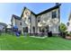 Spacious backyard with artificial turf, patio, and playground at 4335 Bellview Ln, Duluth, GA 30097