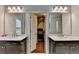 Elegant bathroom with a double vanity and a view into a walk-in closet at 4335 Bellview Ln, Duluth, GA 30097