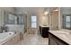 Elegant bathroom with a standalone tub, glass enclosed shower, and double vanity at 4335 Bellview Ln, Duluth, GA 30097