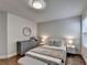 Cozy bedroom with a comfortable bed, a grey dresser, and stylish decor at 4335 Bellview Ln, Duluth, GA 30097