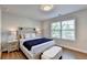 Serene bedroom with a stylish bed, nightstands, and a bright window at 4335 Bellview Ln, Duluth, GA 30097
