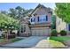 Charming brick two-story home with a well-manicured lawn and a two-car garage at 4335 Bellview Ln, Duluth, GA 30097