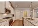 Modern kitchen featuring granite countertops, stainless steel appliances, and ample cabinet space at 4335 Bellview Ln, Duluth, GA 30097