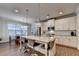 Well-lit kitchen with granite countertops, stainless steel appliances, and a dining area at 4335 Bellview Ln, Duluth, GA 30097