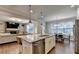 Open concept kitchen featuring granite countertop island with stainless steel appliances and a view to the living area at 4335 Bellview Ln, Duluth, GA 30097