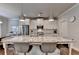 Spacious kitchen island featuring granite countertop with stainless steel appliances and stylish pendant lights at 4335 Bellview Ln, Duluth, GA 30097
