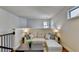 Comfortable sitting area featuring a couch with a chaise lounge and a modern coffee table at 4335 Bellview Ln, Duluth, GA 30097