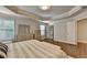Bright and inviting main bedroom with tray ceiling, a bed and lots of dresser storage at 4335 Bellview Ln, Duluth, GA 30097
