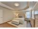 Bright and inviting main bedroom with tray ceiling, a bed and lots of dresser storage at 4335 Bellview Ln, Duluth, GA 30097