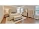 Bright and inviting main bedroom with tray ceiling, a bed and lots of dresser storage at 4335 Bellview Ln, Duluth, GA 30097