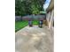 Cozy back patio with seating overlooking a well-maintained backyard at 979 Simonton Glen Dr, Lawrenceville, GA 30045