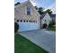 Charming brick home featuring a two-car garage, a well-maintained lawn, and an inviting driveway at 979 Simonton Glen Dr, Lawrenceville, GA 30045