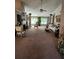 Open living room with fireplace, plush carpeting, ornate furniture, and plenty of natural light at 979 Simonton Glen Dr, Lawrenceville, GA 30045