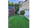 Well-manicured side yard with healthy lawn and attractive landscaping features at 979 Simonton Glen Dr, Lawrenceville, GA 30045