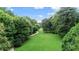Aerial view of the lush green park, walking path, and mature trees at 101 Ardmore Nw Pl # 3, Atlanta, GA 30309