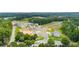 Aerial view of the community surrounded by mature trees and lush landscaping at 114 Crooked Lake Park, Villa Rica, GA 30180