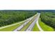 Aerial view of a highway surrounded by lush green forests at 114 Crooked Lake Park, Villa Rica, GA 30180
