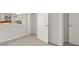 Well-lit bedroom with gray carpet, featuring a closet and white trim at 114 Crooked Lake Park, Villa Rica, GA 30180