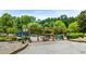 A well-maintained community park with benches, a playground, and plenty of trees for shade and recreation at 114 Crooked Lake Park, Villa Rica, GA 30180