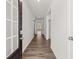 Inviting foyer featuring hardwood floors and neutral walls with entry to other rooms at 114 Crooked Lake Park, Villa Rica, GA 30180