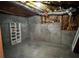 Unfinished basement with concrete walls, exposed insulation, and a small window at 2550 Lynshire Ln, Snellville, GA 30078