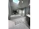 Bathroom with dual sinks with mirrors and plenty of cabinet space; a garden tub is featured at 2550 Lynshire Ln, Snellville, GA 30078
