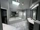 Large bathroom features a garden tub, glass shower, and dual sinks underneath a skylight at 2550 Lynshire Ln, Snellville, GA 30078