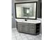Large vanity in the bathroom features neutral tones and multiple drawers and shelves for storage at 2550 Lynshire Ln, Snellville, GA 30078
