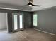 Main bedroom featuring neutral walls, carpet floors, and lots of natural light at 2550 Lynshire Ln, Snellville, GA 30078
