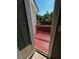 Exterior deck with wood railing and views of the surrounding lush greenery and bright blue sky at 2550 Lynshire Ln, Snellville, GA 30078