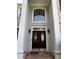 Elegant front entrance with a double door, decorative windows, and a welcoming, covered porch area at 2550 Lynshire Ln, Snellville, GA 30078