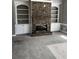Cozy living room featuring a stone fireplace with built-in bookshelves, creating a warm and inviting atmosphere at 2550 Lynshire Ln, Snellville, GA 30078