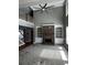 Bright living room with a stone fireplace, custom built-in shelves, and soaring ceilings at 2550 Lynshire Ln, Snellville, GA 30078
