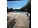 Community pool area features sun loungers, pool, and splash fountain for endless summer fun at 2550 Lynshire Ln, Snellville, GA 30078