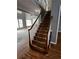 Staircase featuring wooden steps and white railing at 2550 Lynshire Ln, Snellville, GA 30078